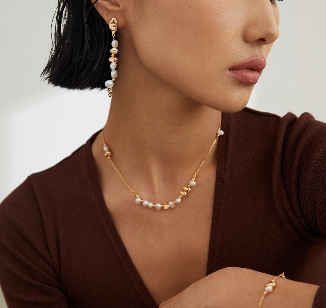 Elegant Baroque Pearl Dangle Beaded Earrings featuring natural pearls and gold vermeil, showcasing unique shapes and luxurious design.