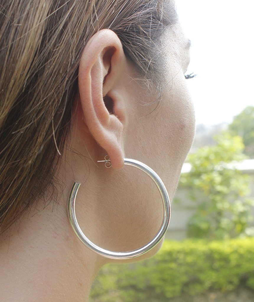 A pair of elegant Basic Semi-Open Hoop Earrings in gold and silver, showcasing their classic design and hypoallergenic features.