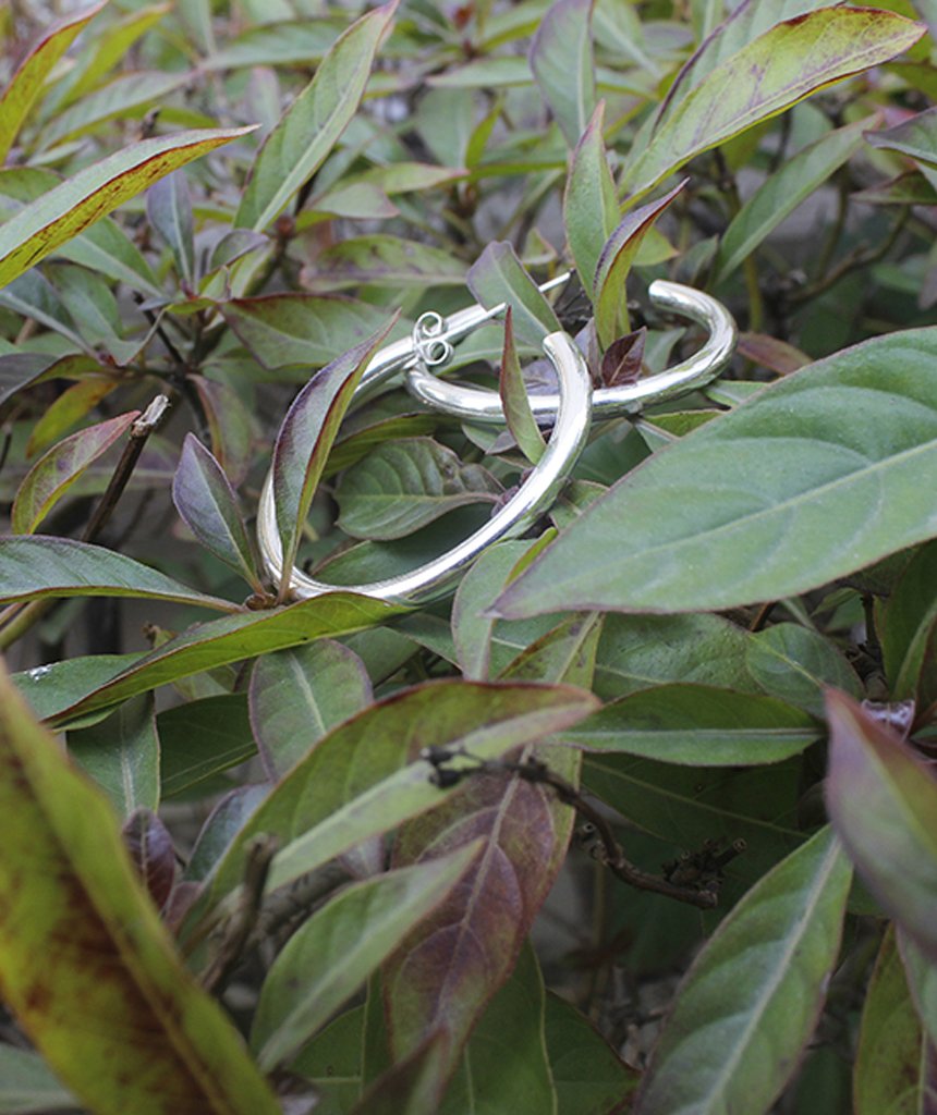 A pair of elegant Basic Semi-Open Hoop Earrings in gold and silver, showcasing their classic design and hypoallergenic features.