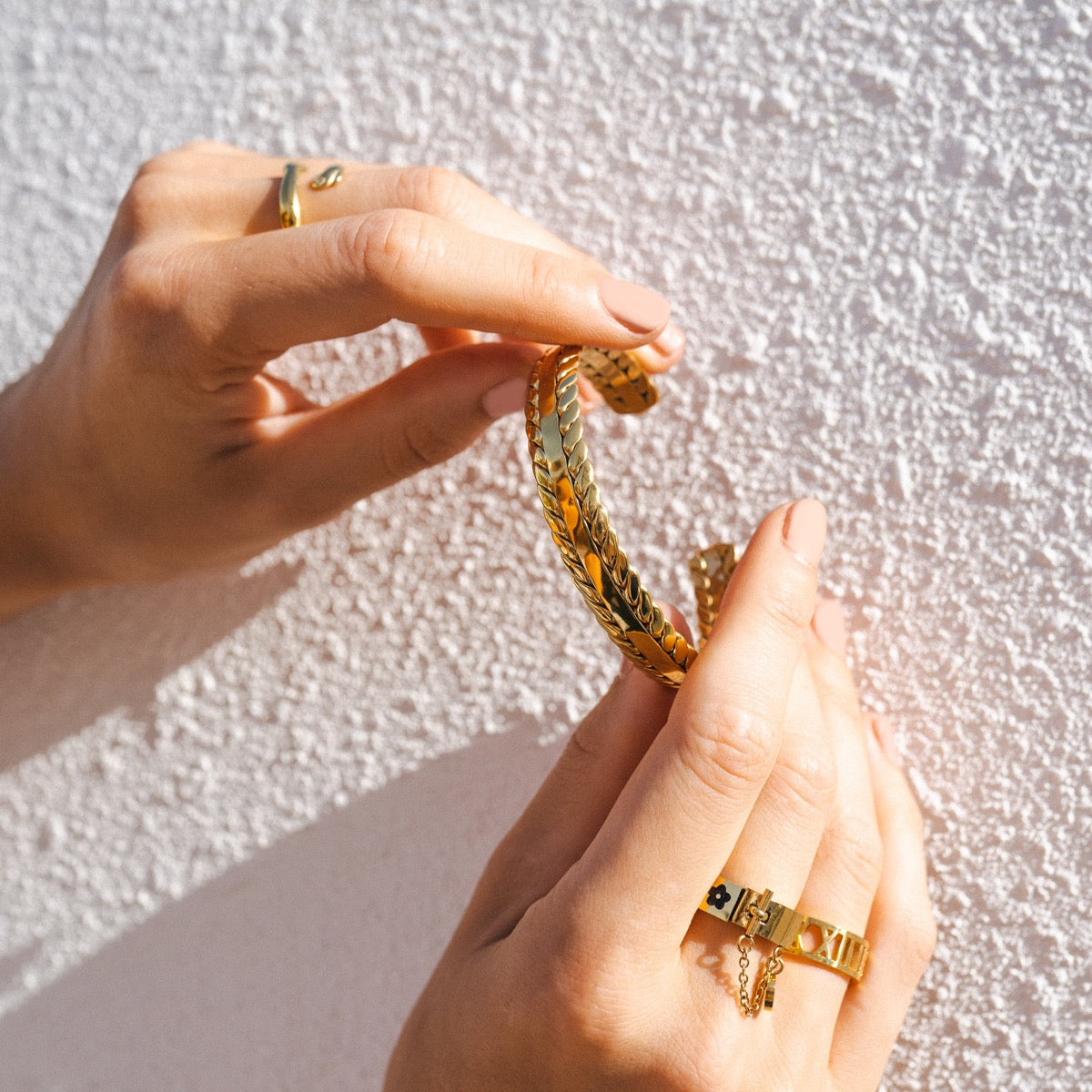 Basma Woven Leaves Bangle featuring intricate woven design and 18k gold plating.