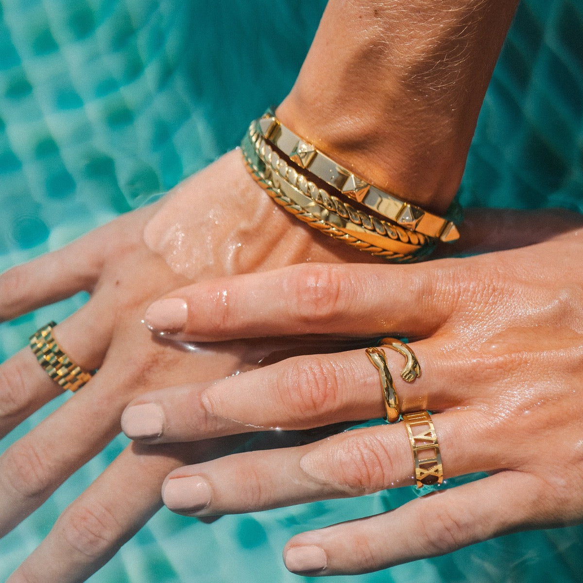 Basma Woven Leaves Bangle featuring intricate woven design and 18k gold plating.