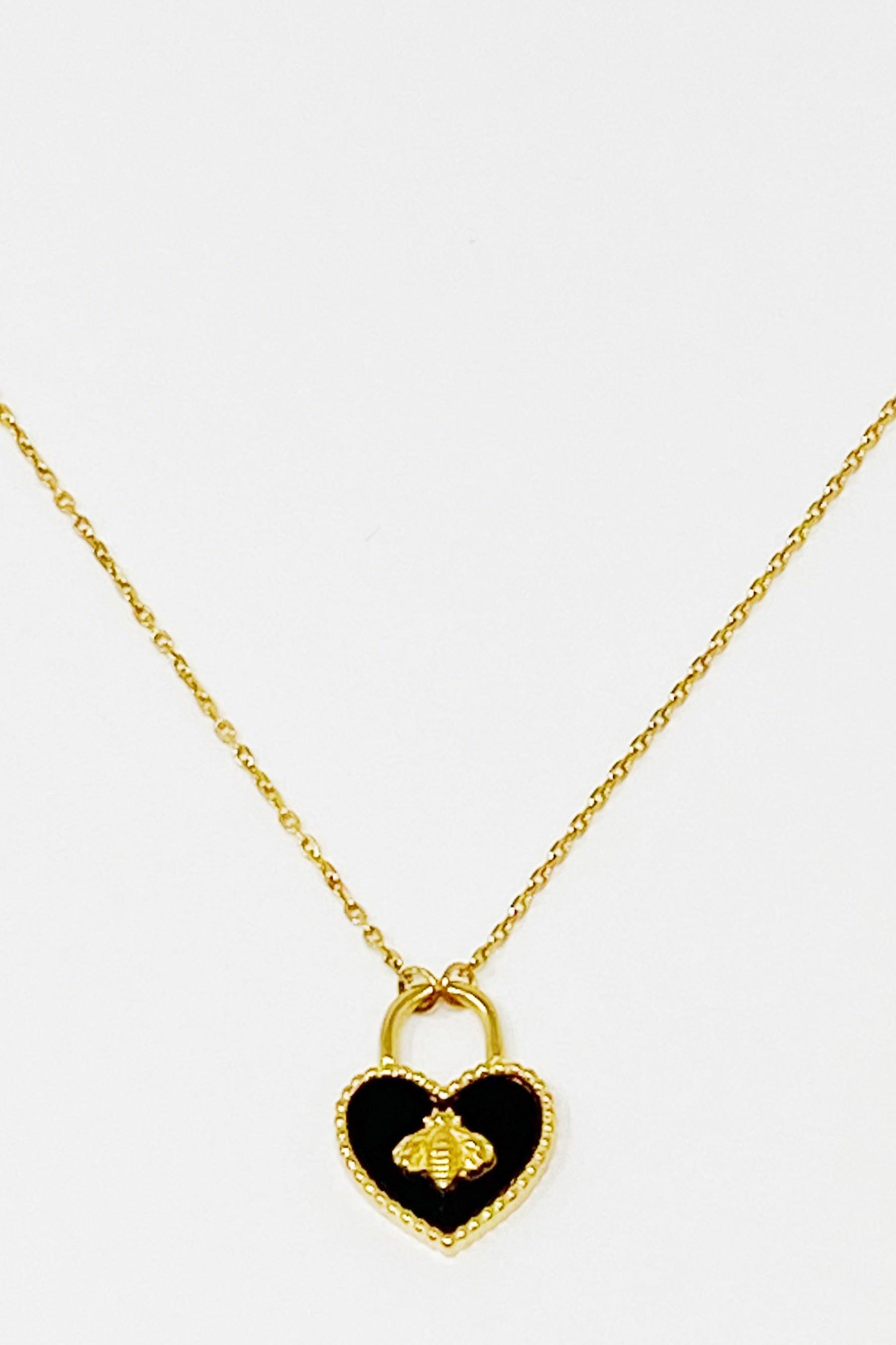 Bee Heartful Necklace featuring a heart pendant with a gold bee centerpiece on a gold plated chain.