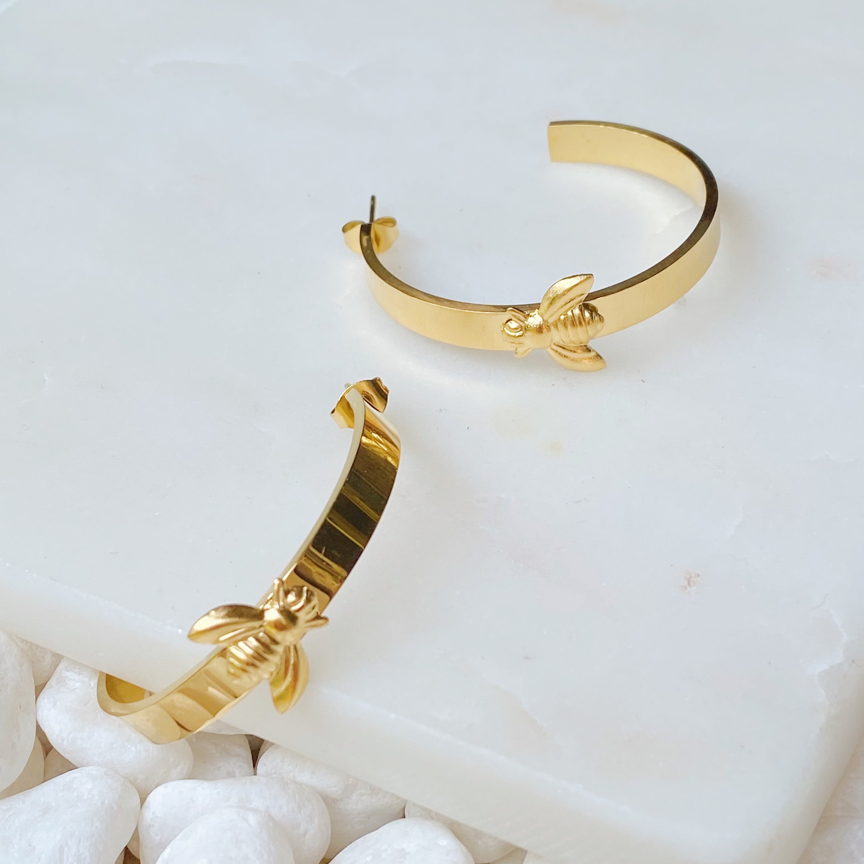 Elegant Bee Lovely Hoop Earrings featuring a bee accent, crafted from stainless steel and 18K gold plated.