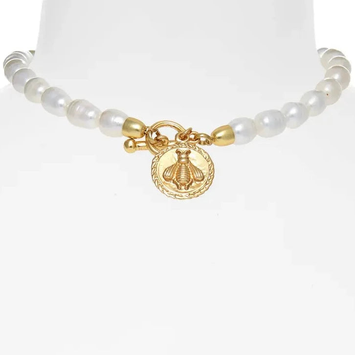 Elegant Bee X Pearl Necklace featuring a gold-plated bee pendant and fresh water pearls on a ball chain.