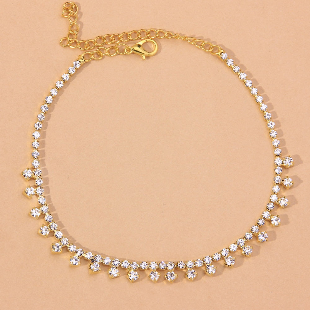 A stylish Beach Barefoot Chain Bracelet featuring zinc alloy and rhinestones, elegantly displayed in a jewelry box.