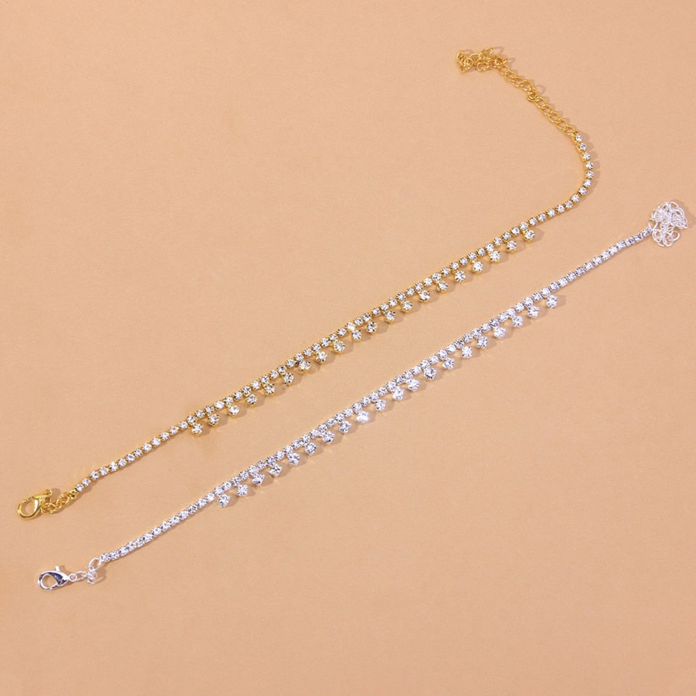 A stylish Beach Barefoot Chain Bracelet featuring zinc alloy and rhinestones, elegantly displayed in a jewelry box.