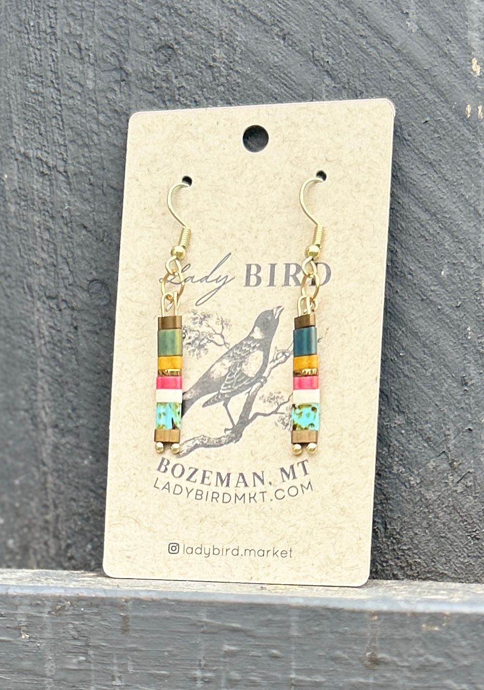 Colorful Beachy Tila Bead Earrings featuring vibrant hues of turquoise, pink, and sandy tan, with silver or gold accents.