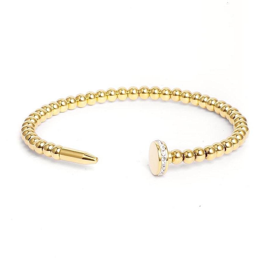 A stylish Beaded Nail Bracelet featuring 18K gold plating over sterling silver, showcasing its unique beaded design.