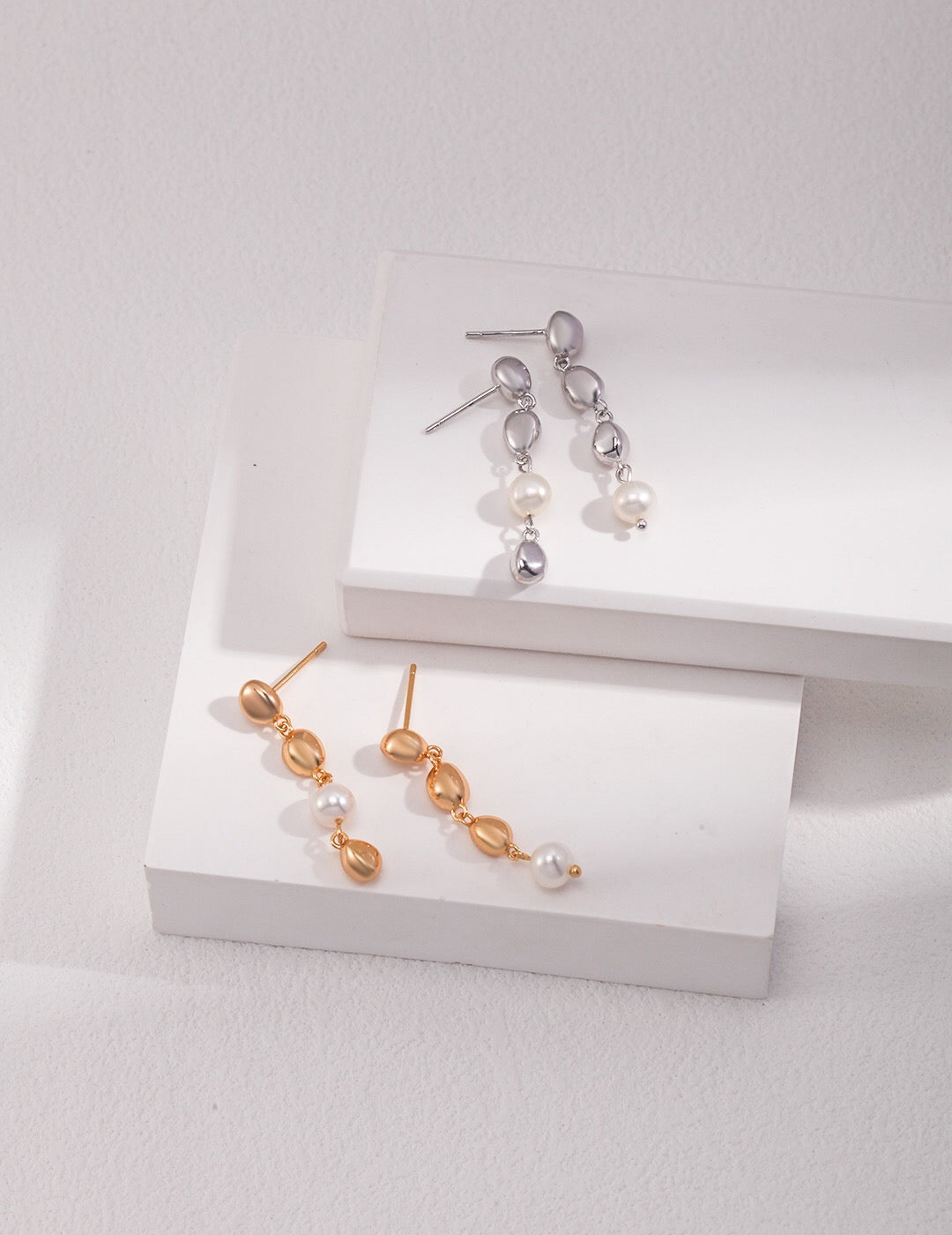 Elegant Bean and Pearl Cascade Earrings featuring freshwater pearls and sterling silver with gold vermeil plating.