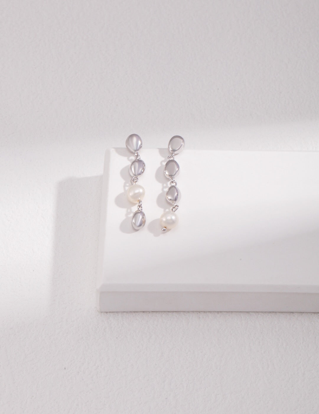 Elegant Bean and Pearl Cascade Earrings featuring freshwater pearls and sterling silver with gold vermeil plating.