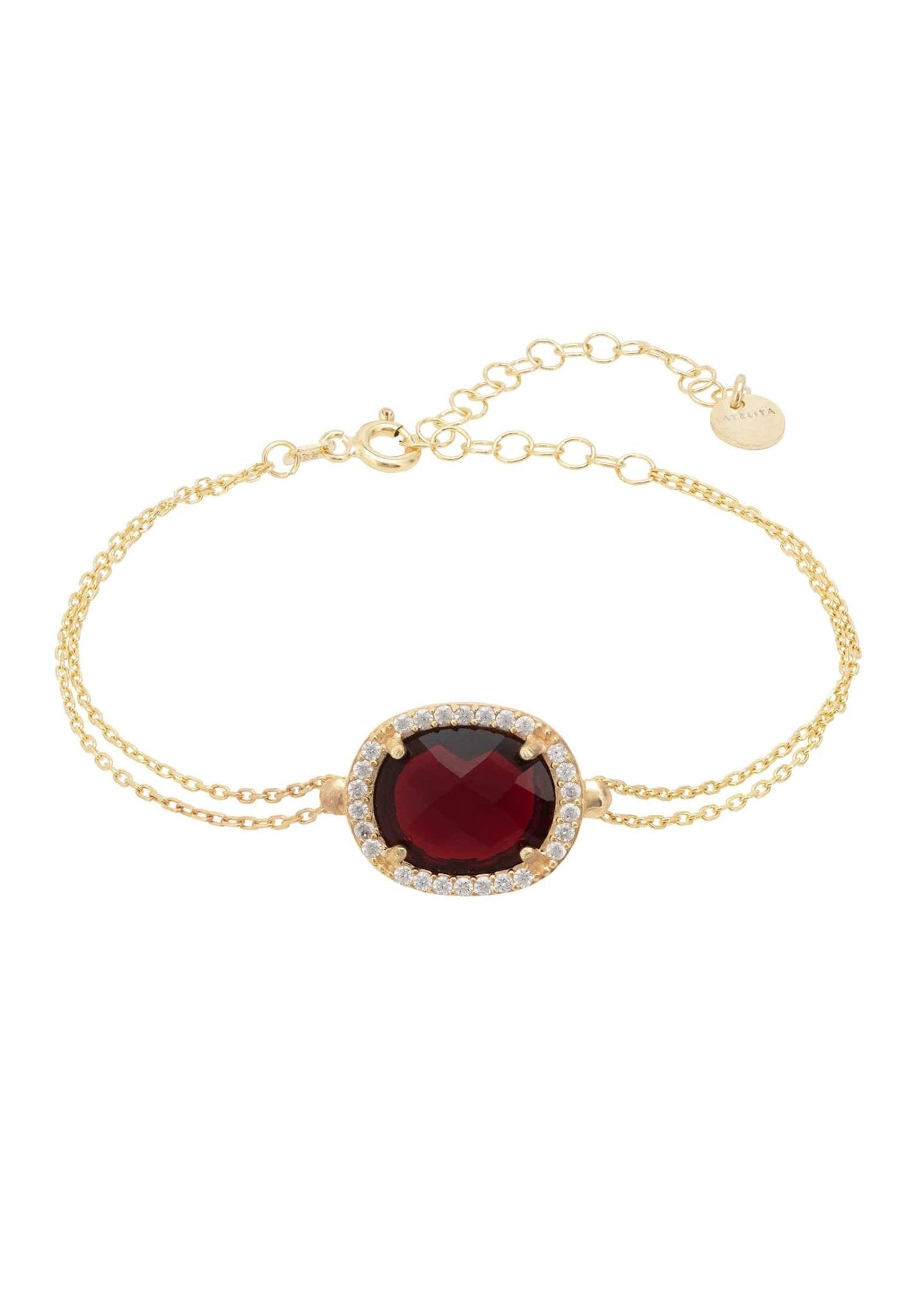 Beatrice Oval Gemstone Bracelet featuring a multifaceted garnet surrounded by cubic zirconia on a gold plated double chain.