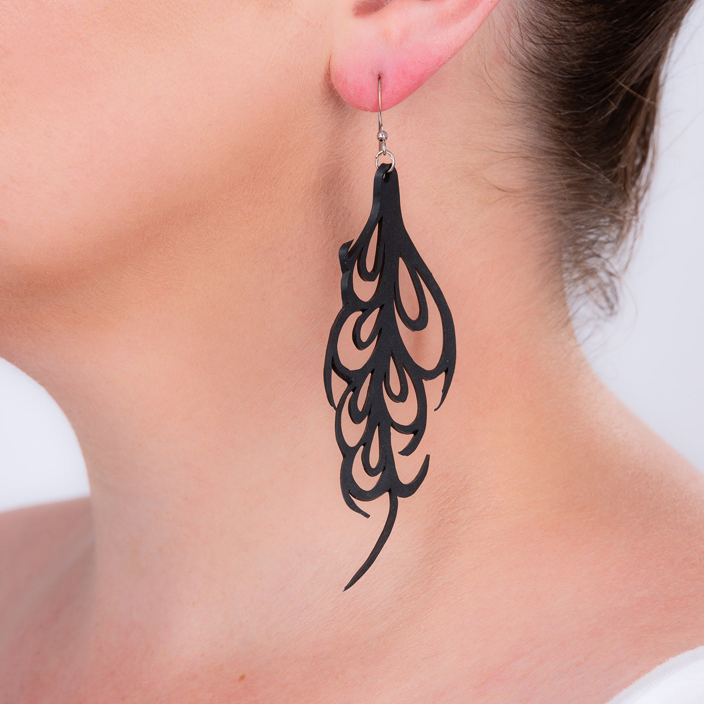 Bella Elegant Art Nouveau Inner Tube Earrings handcrafted from recycled rubber with sterling silver hooks, showcasing unique textures and patterns.