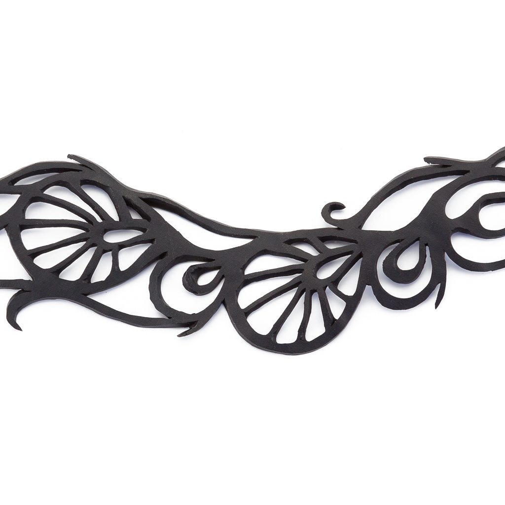 Bella Elegant Inner Tube Choker made from recycled rubber, featuring intricate handcrafted designs and adjustable button closures.