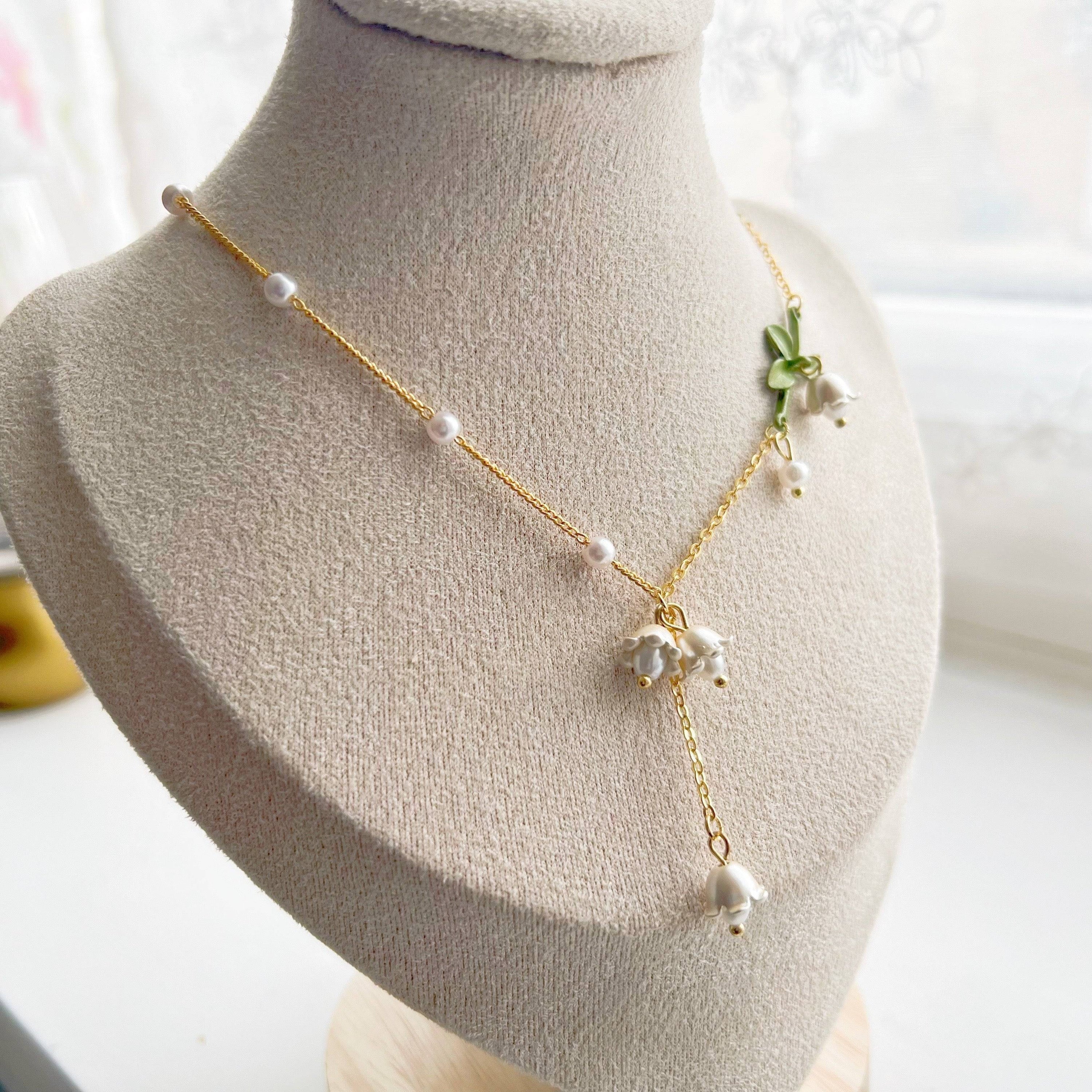 Bellflower Necklace featuring a white Campanula flower design on a gold-plated bronze chain with an artificial pearl.