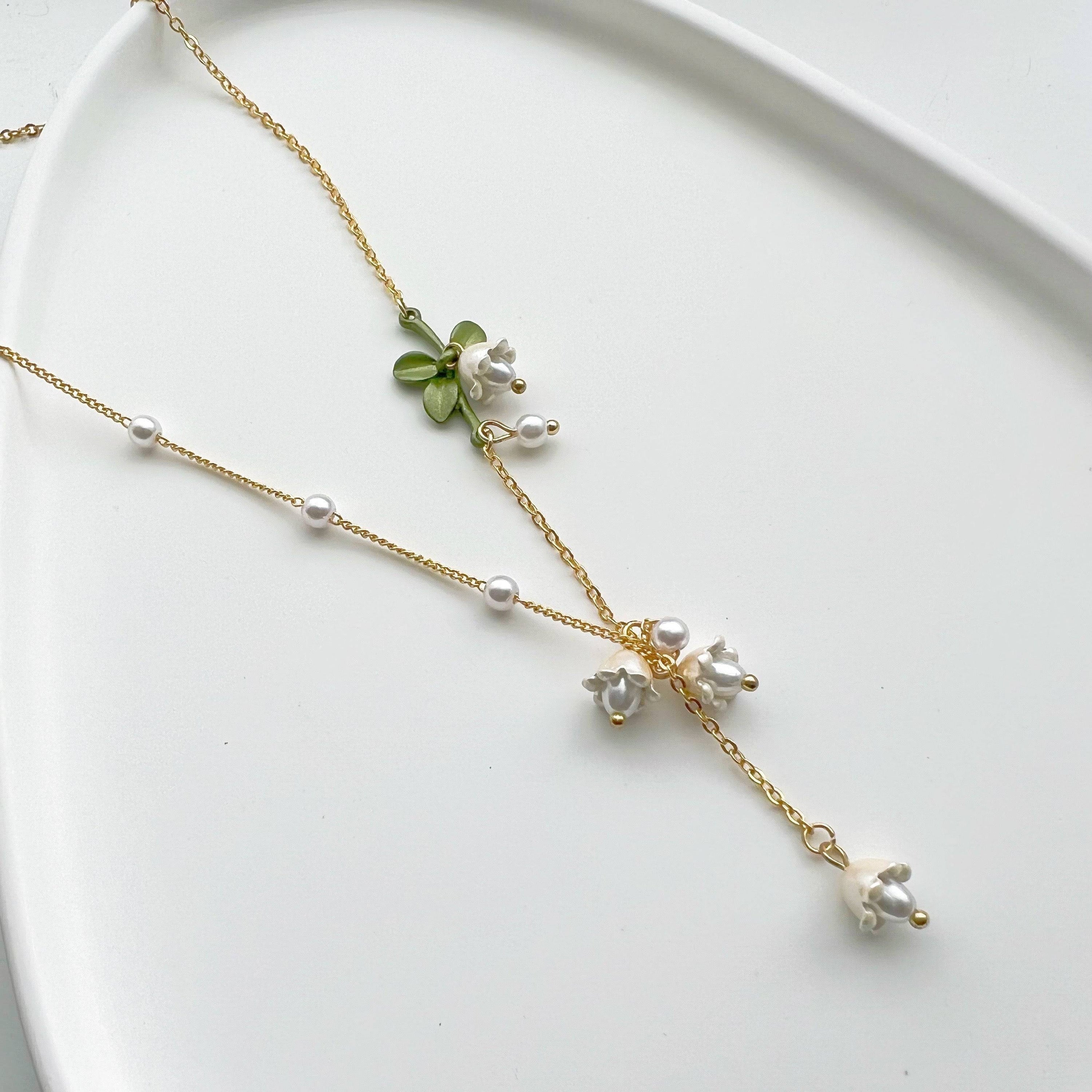 Bellflower Necklace featuring a white Campanula flower design on a gold-plated bronze chain with an artificial pearl.