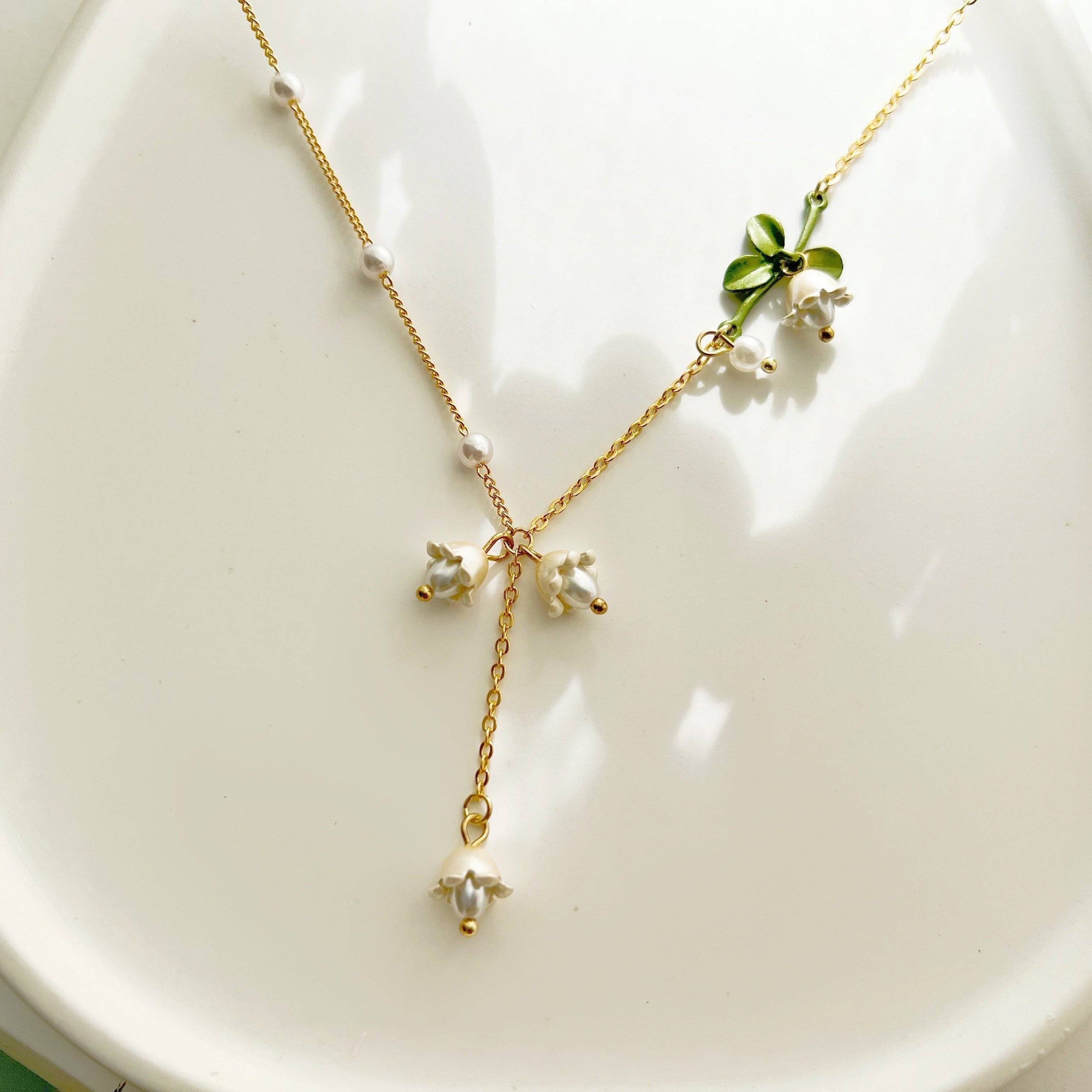 Bellflower Necklace featuring a white Campanula flower design on a gold-plated bronze chain with an artificial pearl.