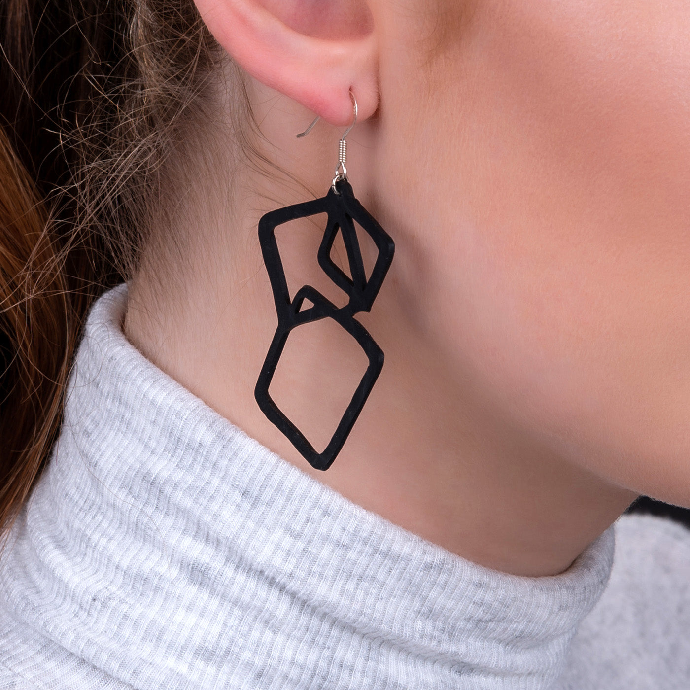 Belinda Geometric Recycled Rubber Earrings featuring a unique geometric design made from reclaimed tyre inner tubes with sterling silver hooks.