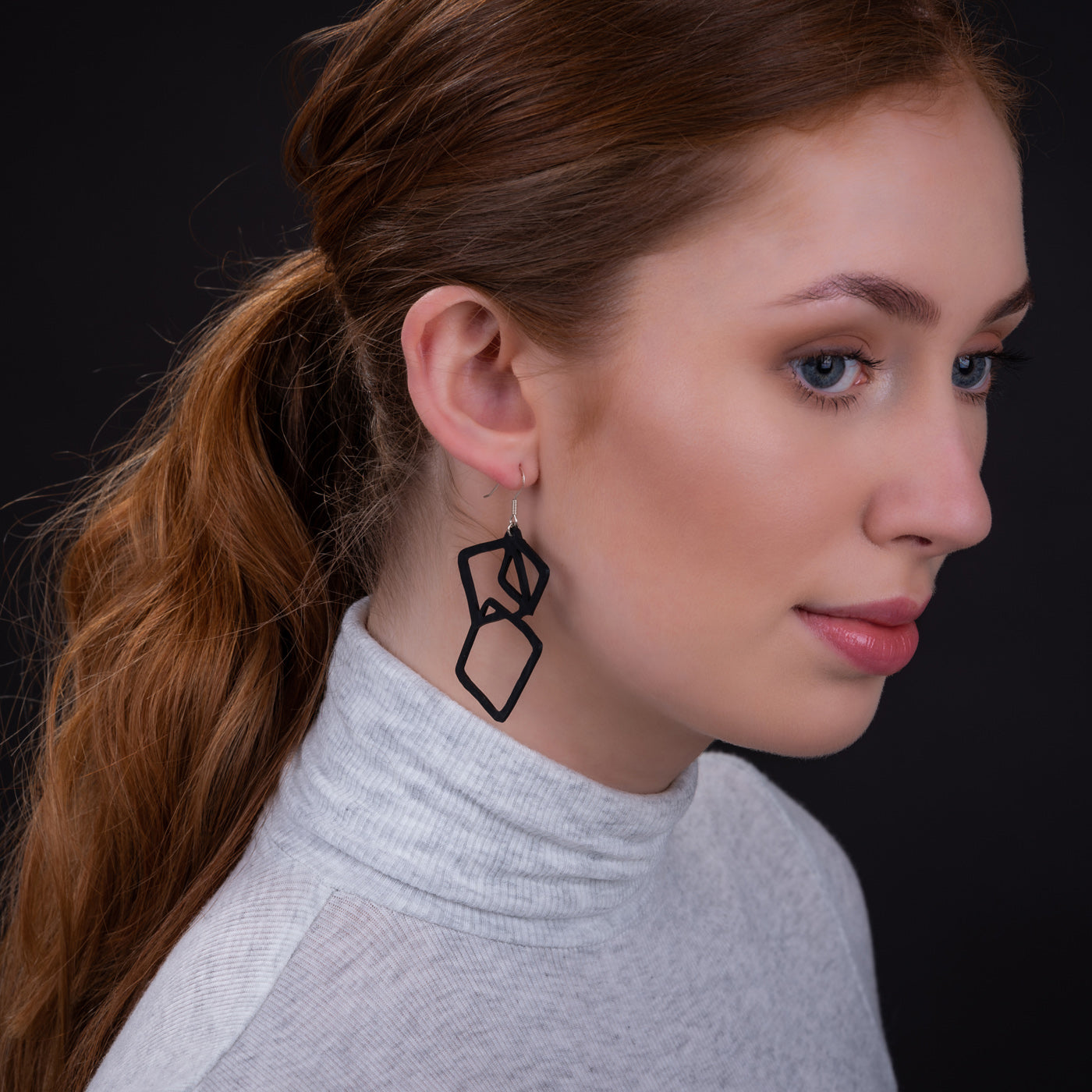 Belinda Geometric Recycled Rubber Earrings featuring a unique geometric design made from reclaimed tyre inner tubes with sterling silver hooks.