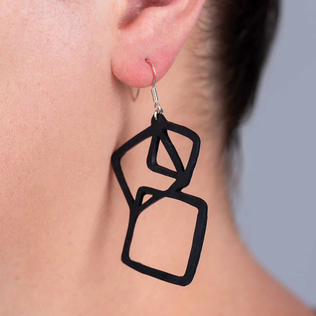 Belinda Geometric Recycled Rubber Earrings featuring a unique geometric design made from reclaimed tyre inner tubes with sterling silver hooks.