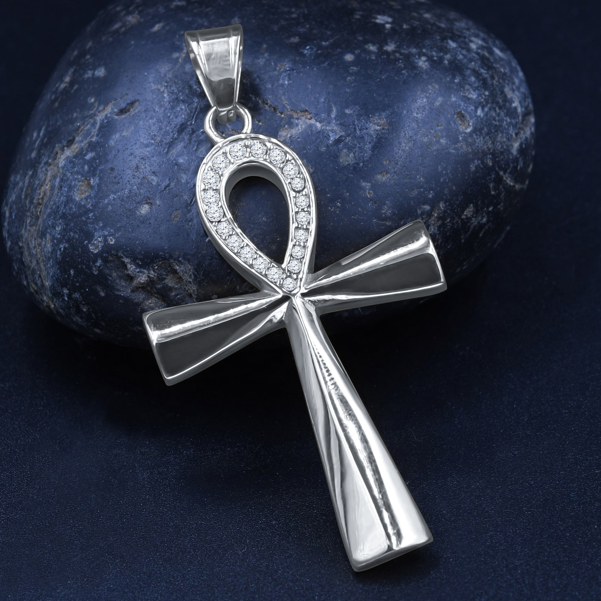 BENDECIR Pendant featuring a uniquely shaped cross design adorned with sparkling cubic zirconia stones, crafted from durable stainless steel.