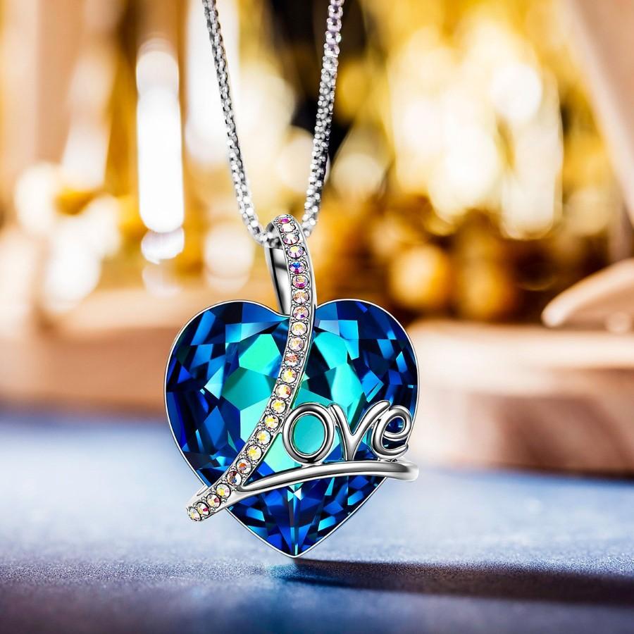 Bermuda Blue Heart Shaped Elements Lining Necklace featuring a blue heart pendant on a 14K white gold plated link chain.