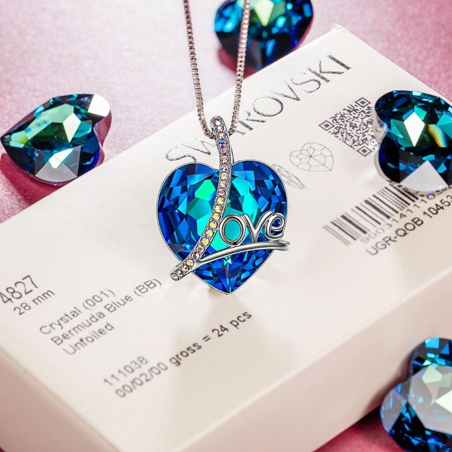 Bermuda Blue Heart Shaped Elements Lining Necklace featuring a blue heart pendant on a 14K white gold plated link chain.