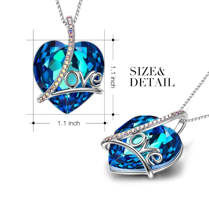 Bermuda Blue Heart Shaped Elements Lining Necklace featuring a blue heart pendant on a 14K white gold plated link chain.