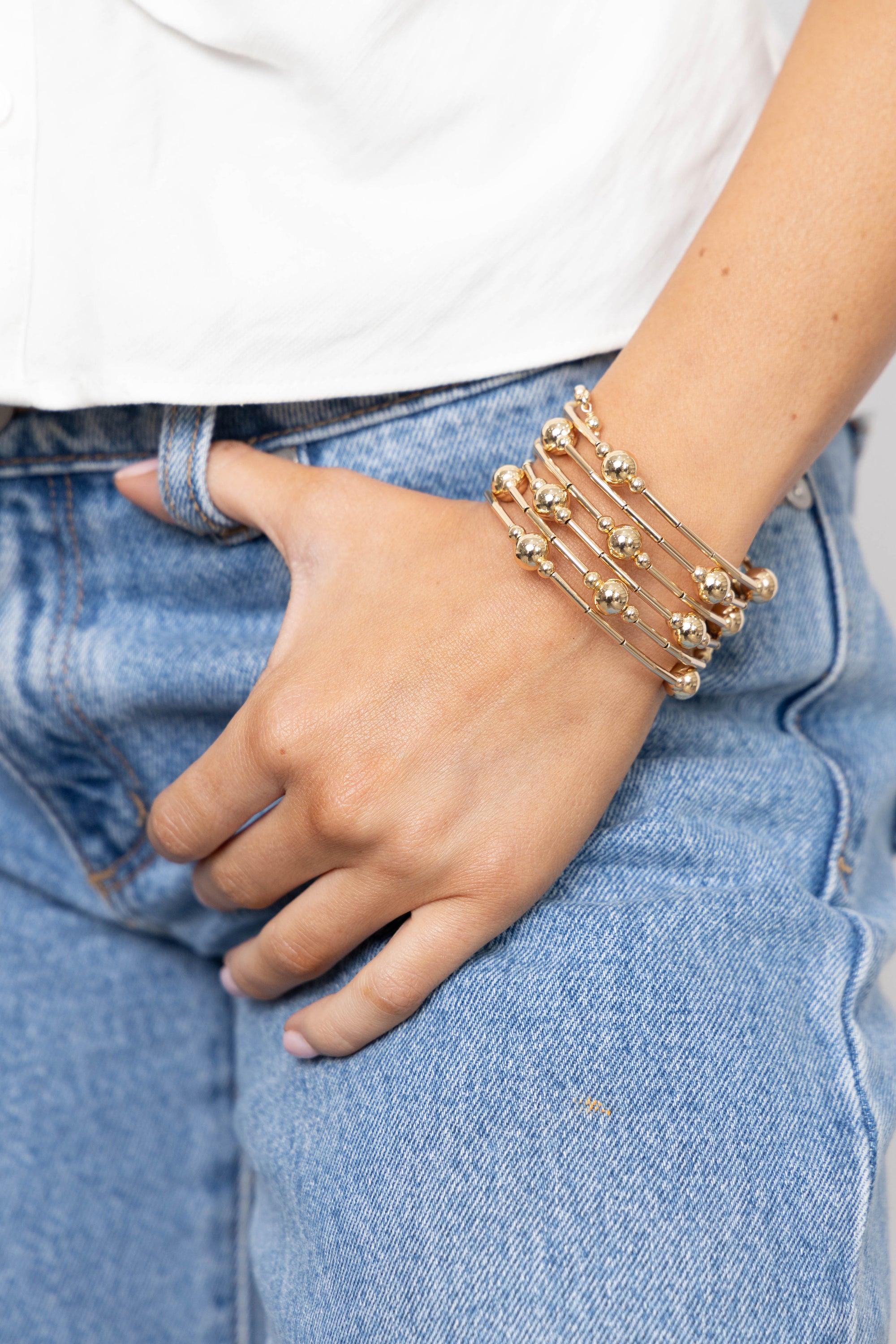 Bianca Wrap Bracelet featuring gold-filled beads in a multi-wrap design, handmade in Brazil.