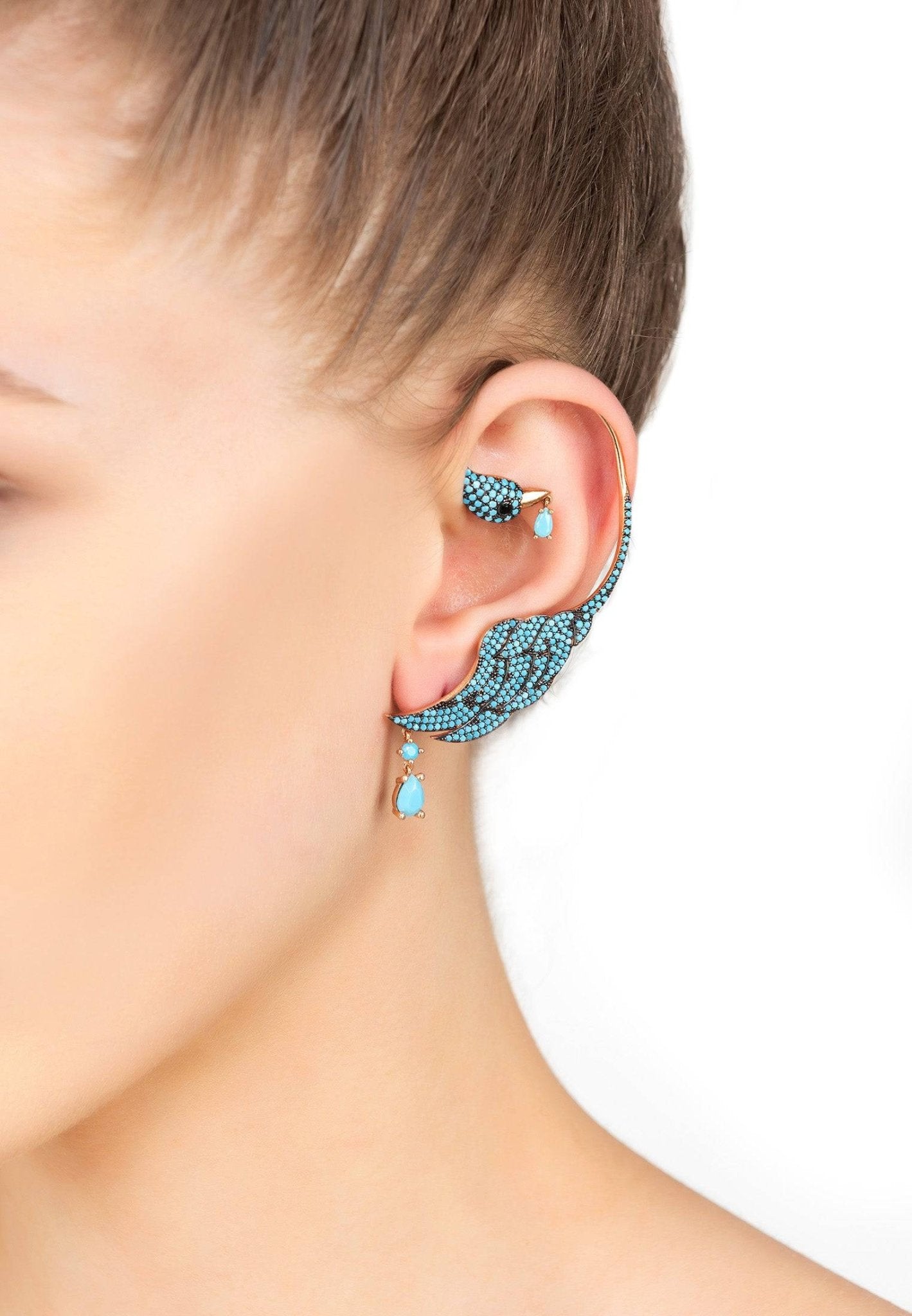 Bird Paradise Ear Climber in Turquoise Gold, featuring a bird design with dangling gemstone, crafted from sterling silver and gold.