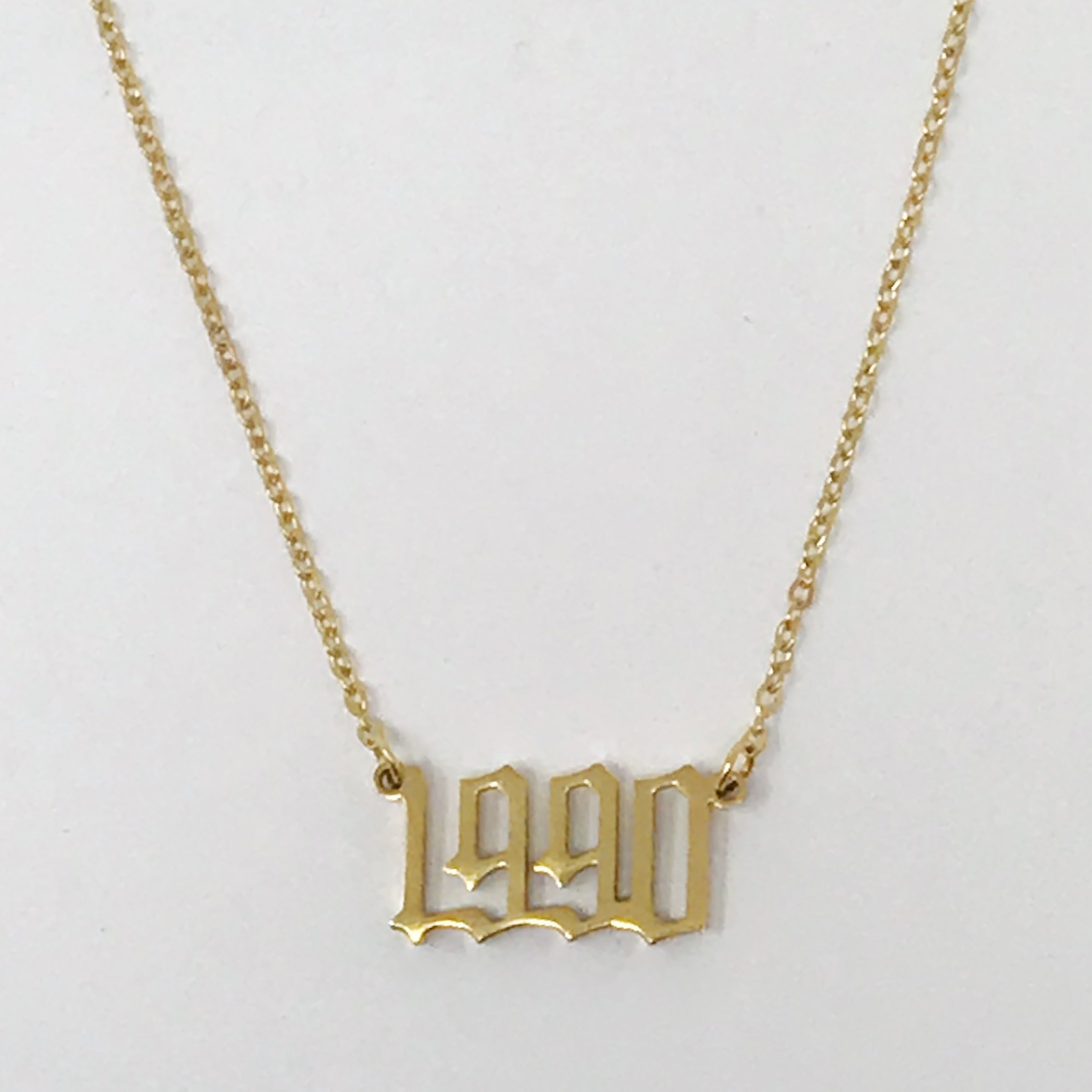 Birth Year Necklace featuring old English font, 16-inch chain with extender, and 18K gold plated stainless steel.