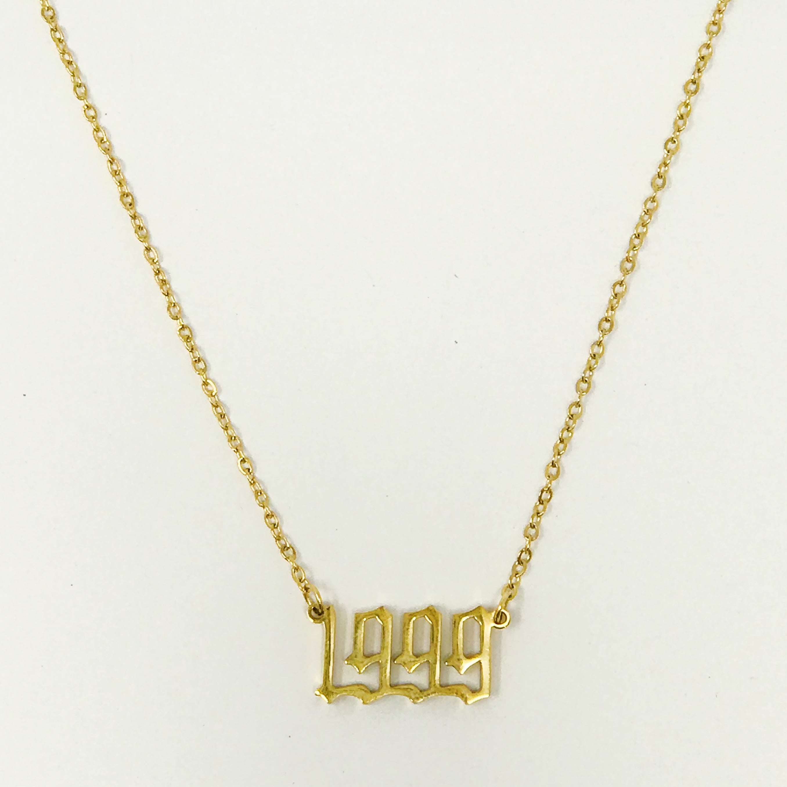 Birth Year Necklace featuring old English font, 16-inch chain with extender, and 18K gold plated stainless steel.