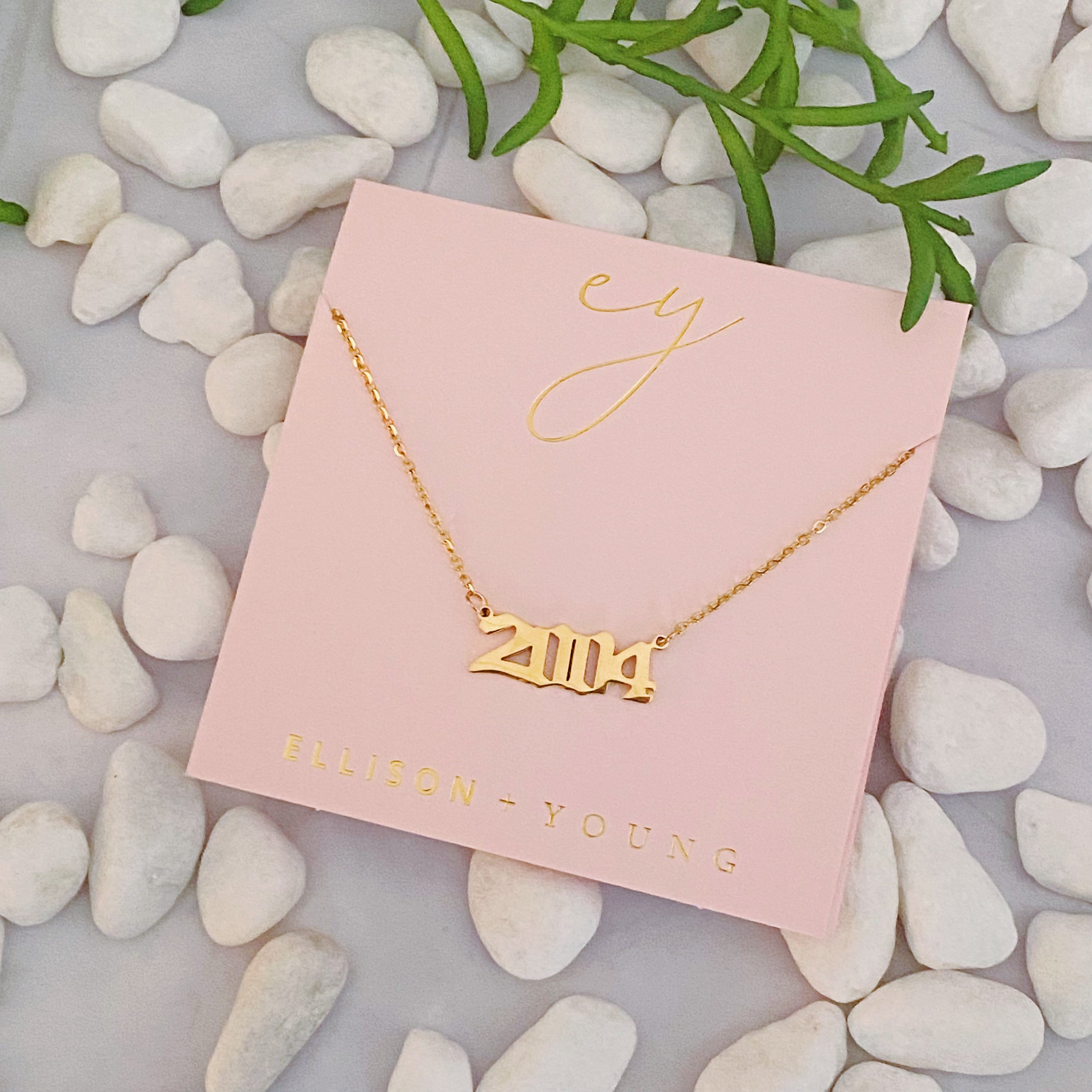 Birth Year Necklace featuring old English font, 16-inch chain with extender, and 18K gold plated stainless steel.