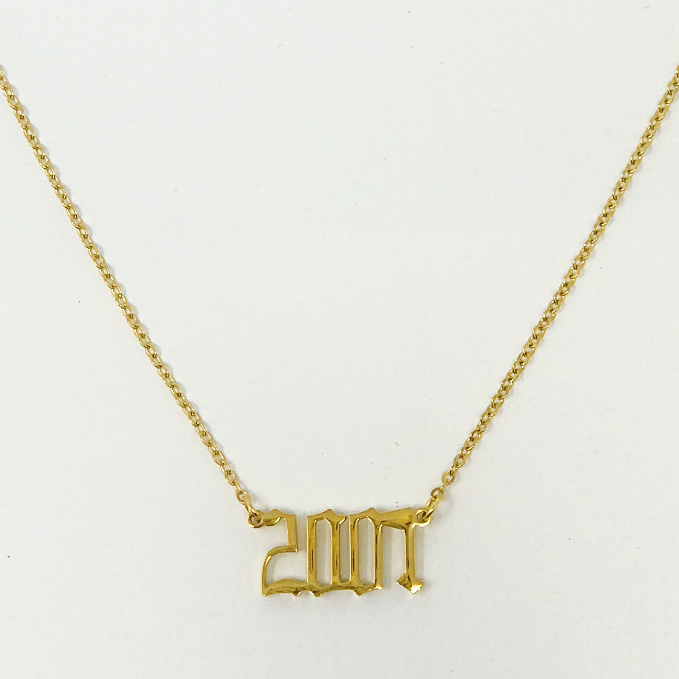 Birth Year Necklace featuring old English font, 16-inch chain with extender, and 18K gold plated stainless steel.