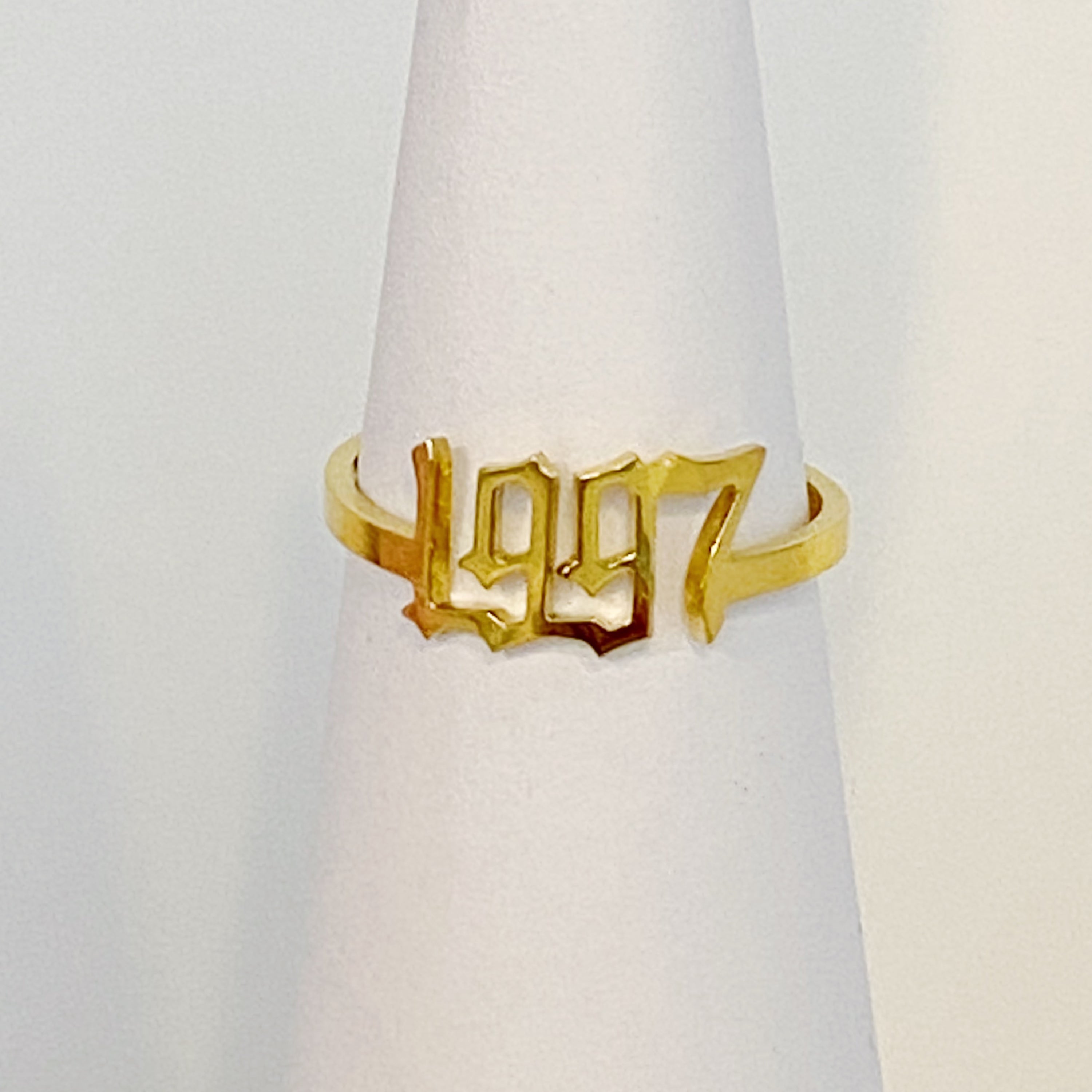 A stylish Birth Year Ring featuring the years 1993 to 2003 in an elegant old English font, crafted from stainless steel and gold plated.