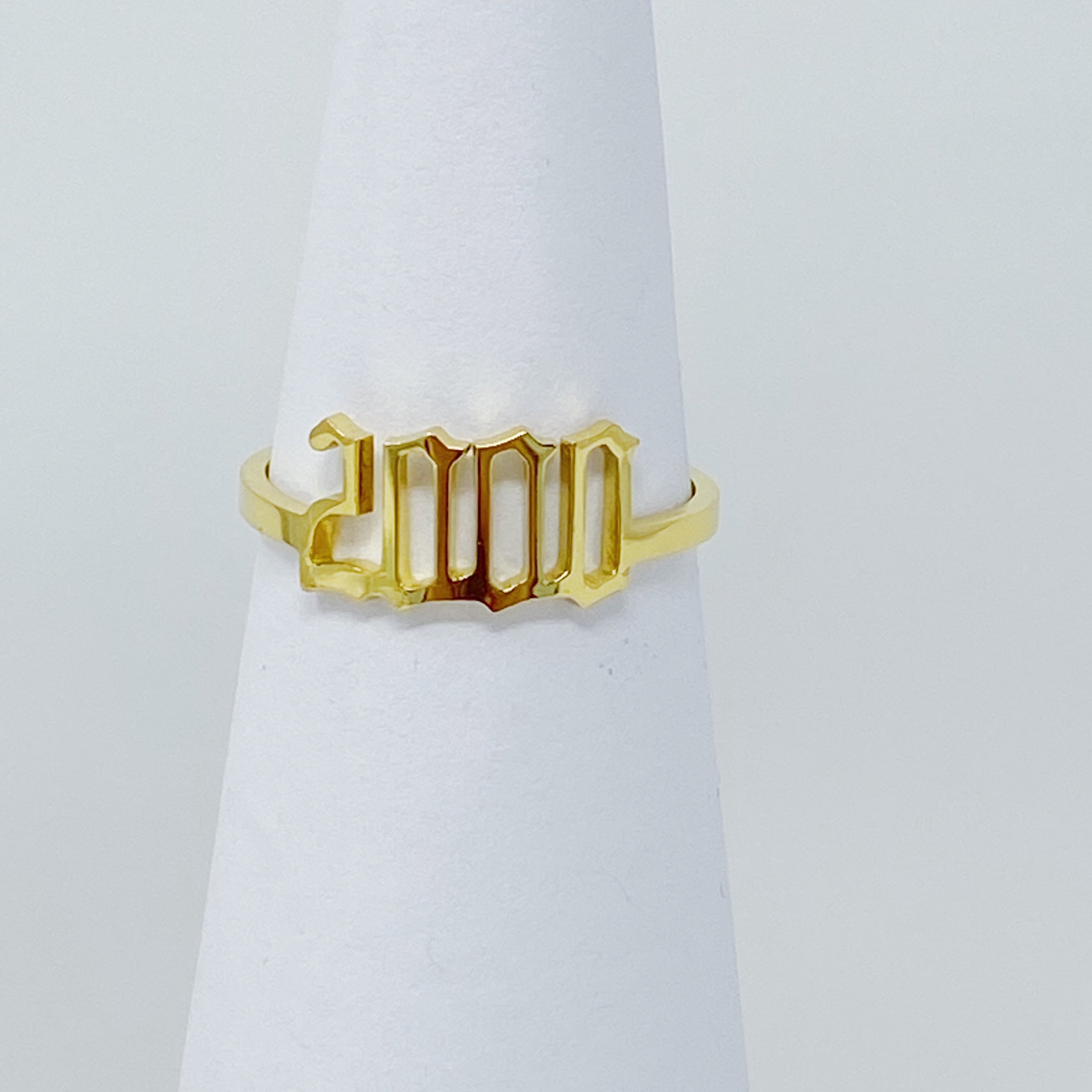 A stylish Birth Year Ring featuring the years 1993 to 2003 in an elegant old English font, crafted from stainless steel and gold plated.