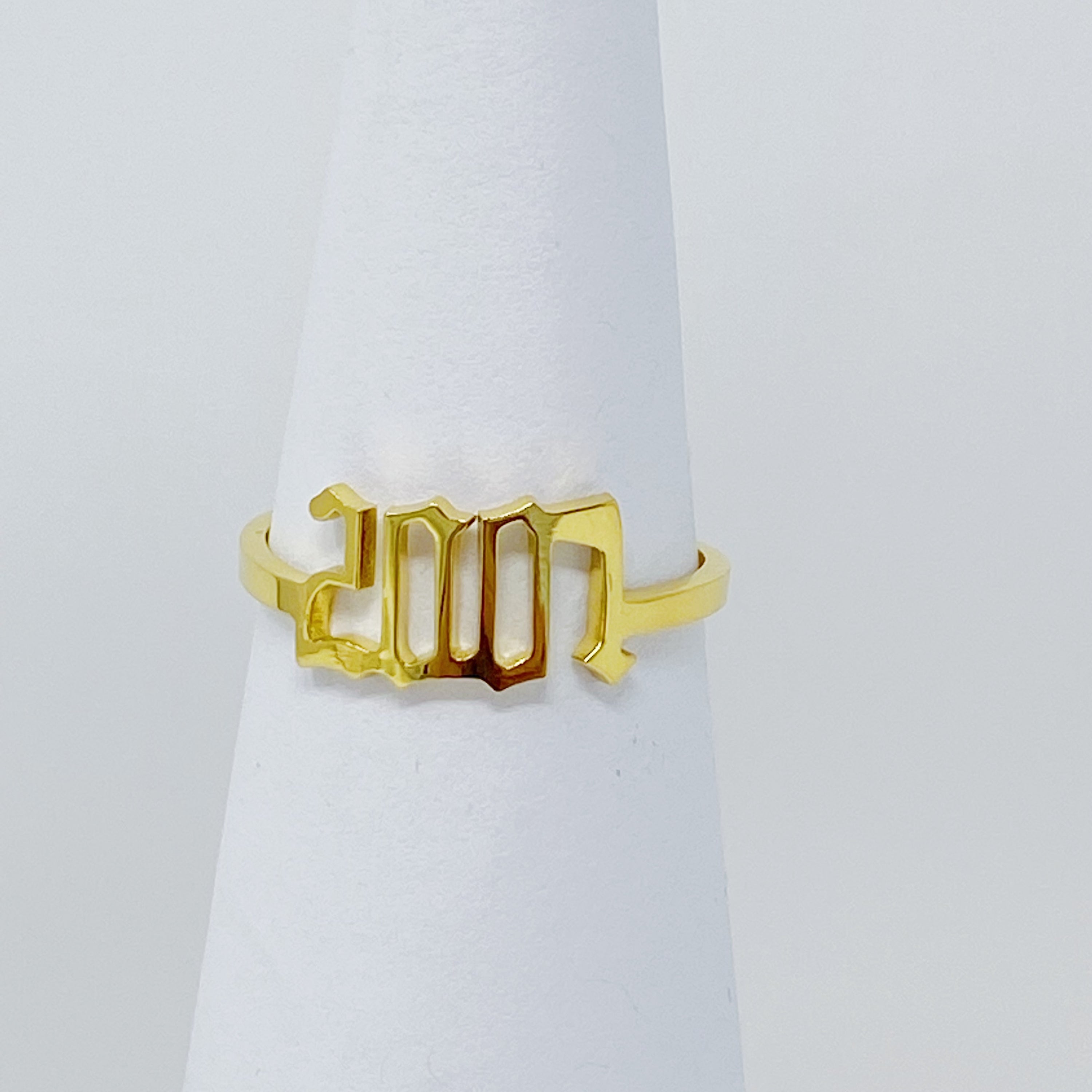 A stylish Birth Year Ring featuring the years 1993 to 2003 in an elegant old English font, crafted from stainless steel and gold plated.