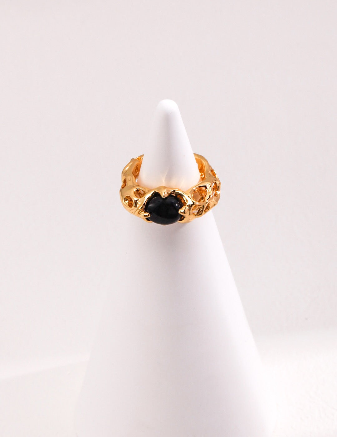 A stunning handmade Black Agate Ring featuring a gold vermeil band, showcasing a polished black agate stone.