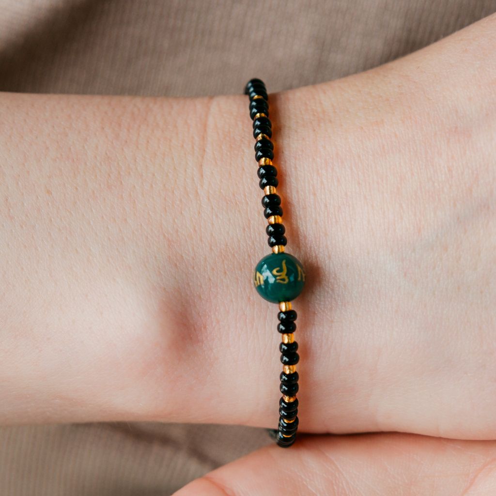 Black Bead Buddhist Tibetan Prayer Monk OM Mantra Nazaria Bracelet with intricate prayer beads and a minimalist design.