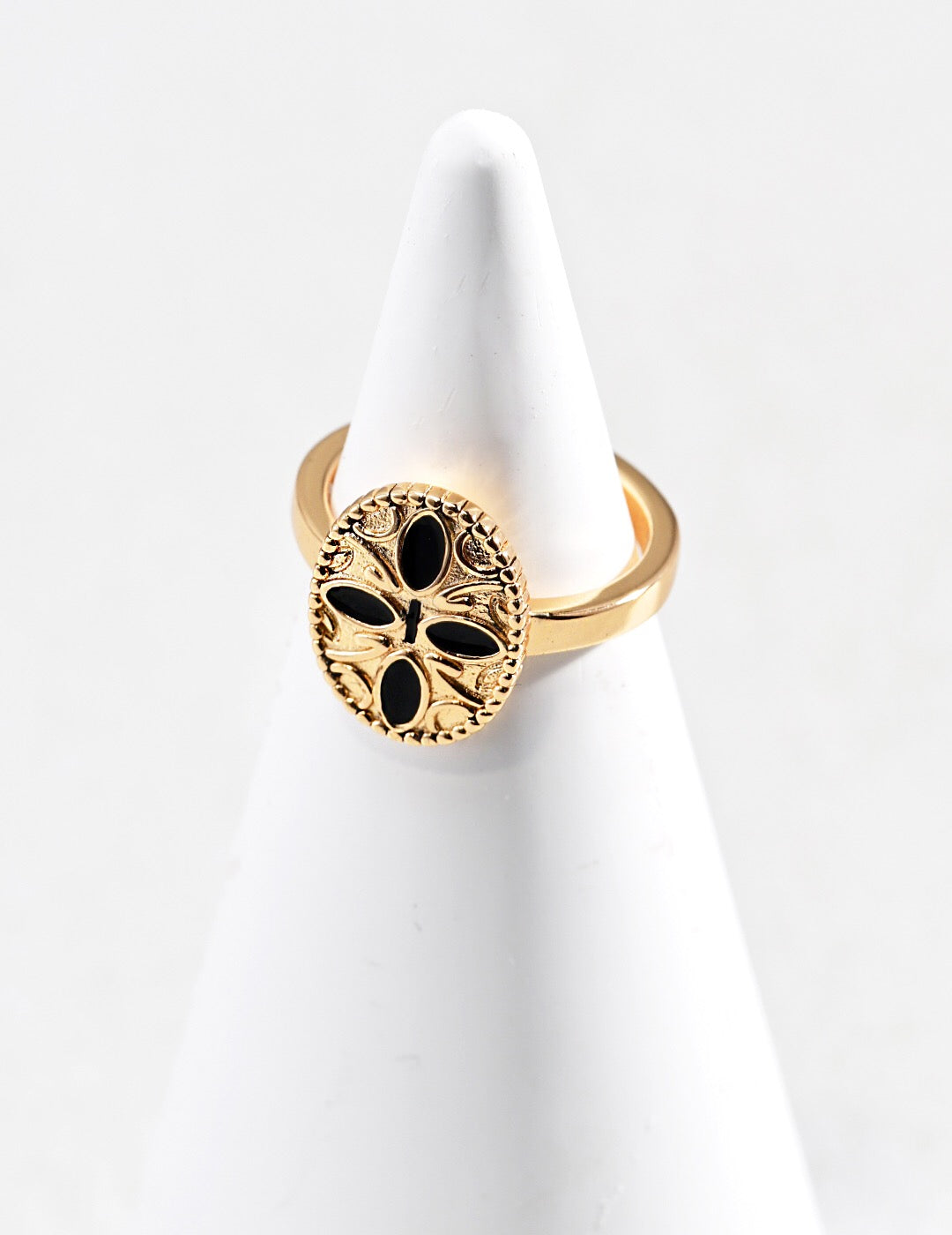 Black Cross Print Drop Glaze Ring featuring a unique drip glaze finish and gold vermeil plating, elegantly displayed in a jewelry pouch.