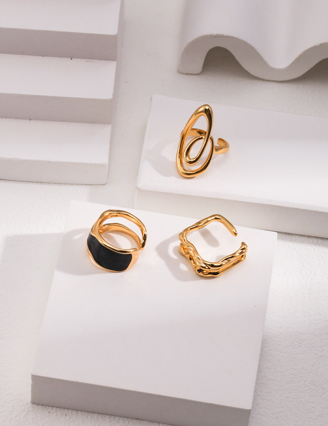 A stunning black enamel ring with gold vermeil plating, showcasing its elegant design and craftsmanship.