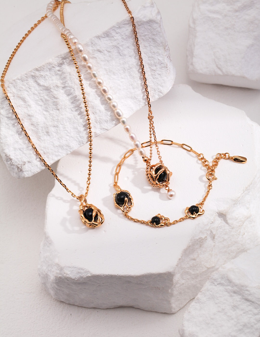 Elegant Black Onyx Elemental Design Necklace featuring a black onyx pendant and gold vermeil chain, showcasing its luxurious craftsmanship.