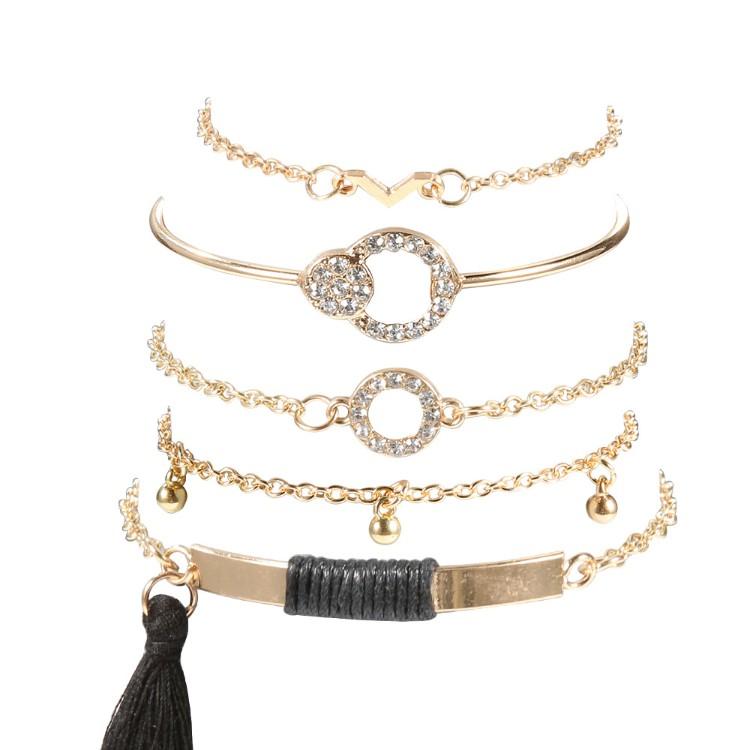 Black Tassel Pav'e 5 Piece Bracelet Set featuring 14K gold plating, black tassel design, and white crystal pav'e accents.