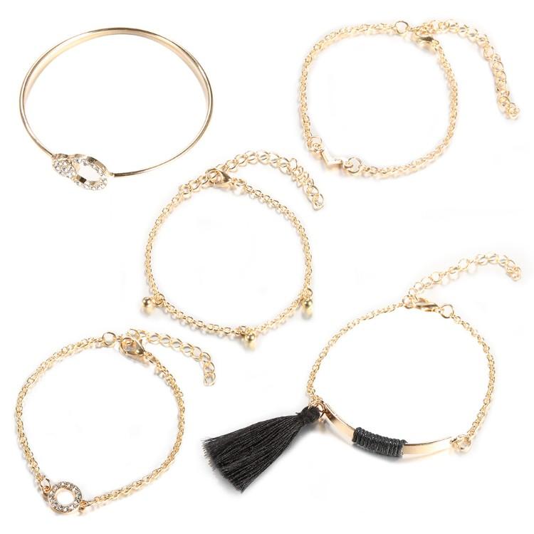 Black Tassel Pav'e 5 Piece Bracelet Set featuring 14K gold plating, black tassel design, and white crystal pav'e accents.