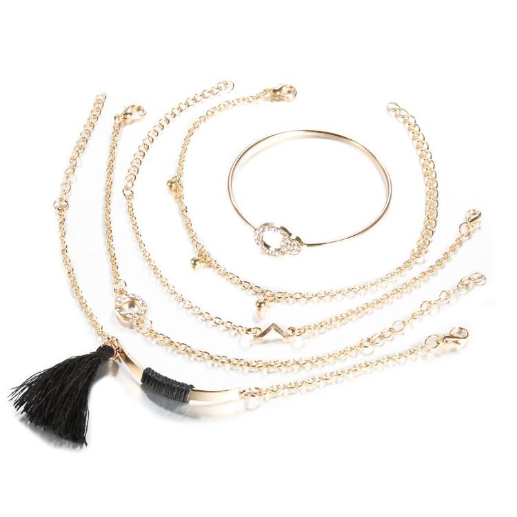 Black Tassel Pav'e 5 Piece Bracelet Set featuring 14K gold plating, black tassel design, and white crystal pav'e accents.