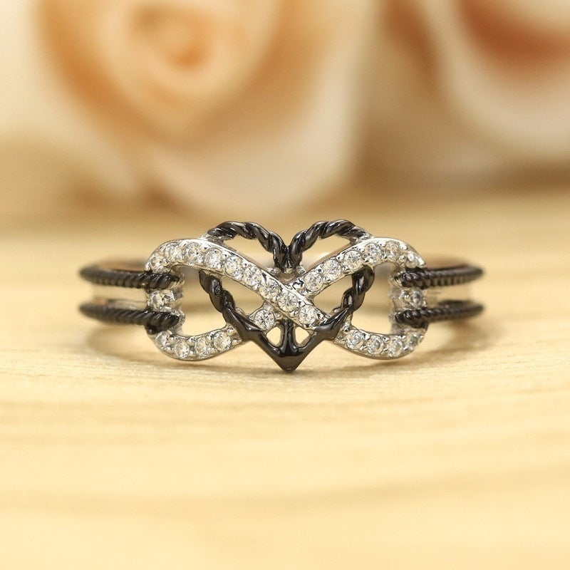 Black & White Italian Crystal Pav'e Rope Forever Love Ring featuring intertwined design and white stone, plated in 14K white gold.