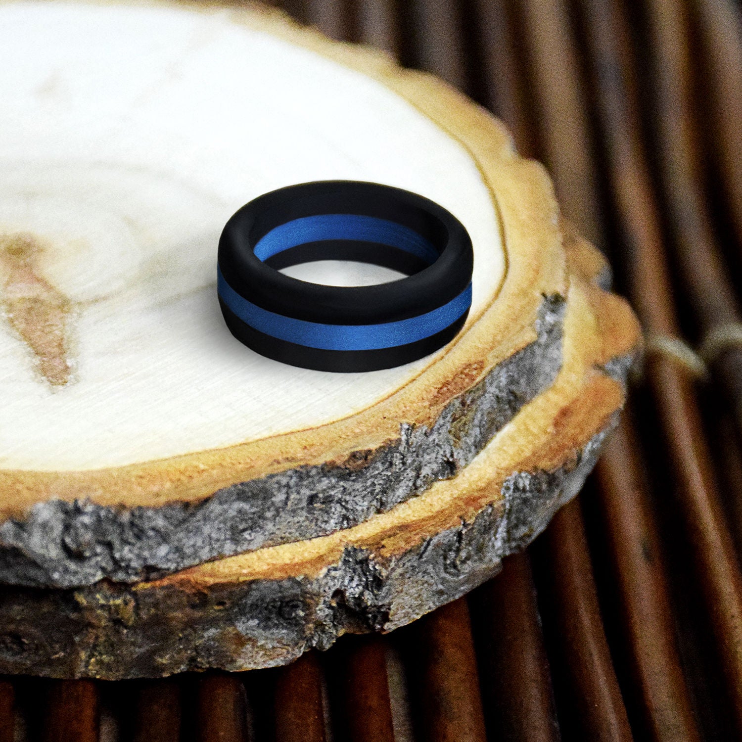 Black and blue striped silicone ring designed for comfort and durability, perfect for sports fans.