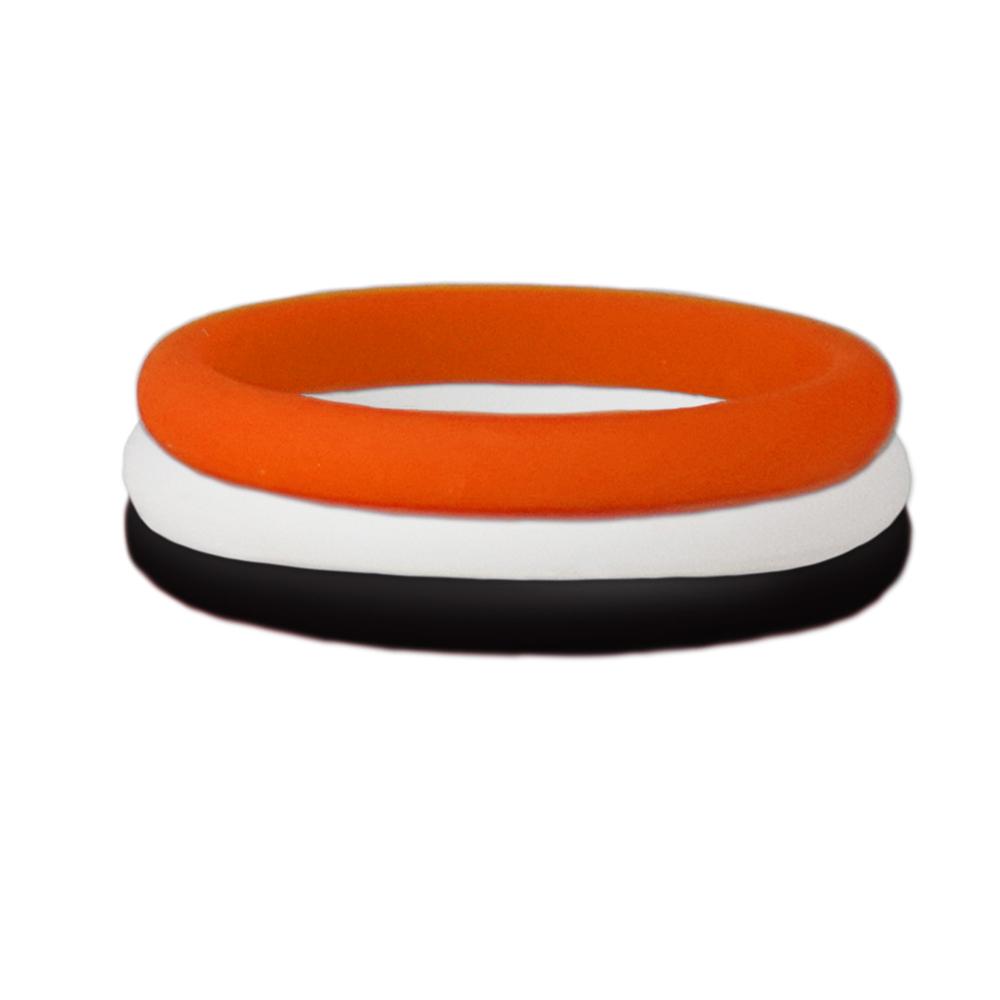 Black, orange, and white stackable silicone ring displayed on a neutral background, showcasing its sleek design and vibrant colors.