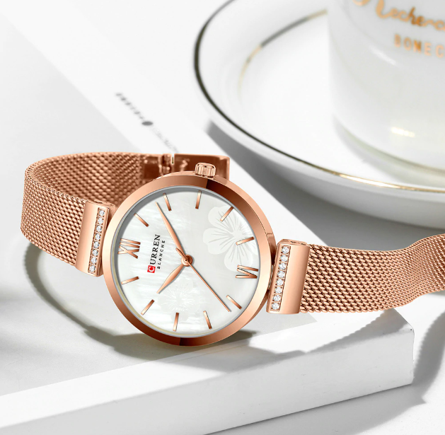 Blith Women's Watch I 551125 with a sleek metal chain strap and simple white dial, available in pink and silver colors.