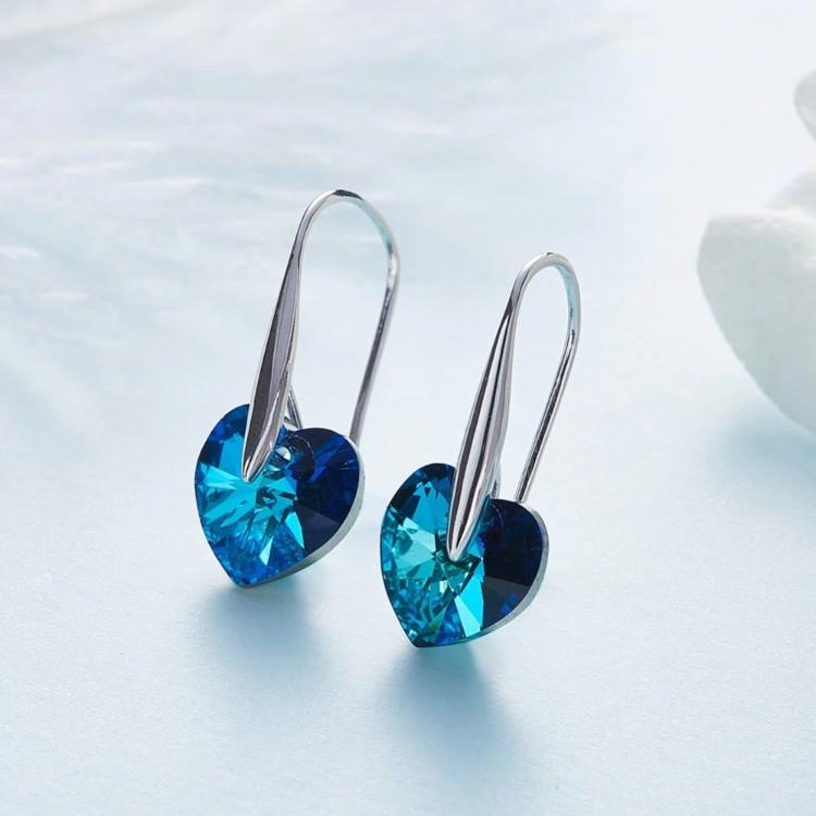 Elegant blue heart-shaped drop earrings made of 14K white gold, featuring vibrant blue elements stones, perfect for any occasion.