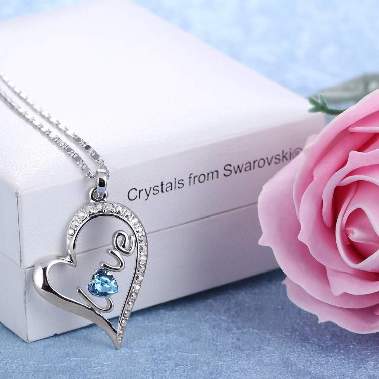 Blue Elements Pav'e Heart Shaped Necklace in 14K White Gold with a heart-shaped pendant and blue stones, elegantly displayed in a gift box.